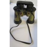 A pair of binoculars with olive green finish, possibly Carl Zeiss and from a WW2 German U-boat,