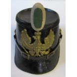 A German policeman's helmet, with gilt metal eagle crest to the front bearing monogram FR