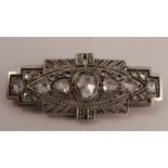 An Art Deco rose diamond set panel brooch, set with fifteen stones, mount unmarked, 4.3cm long, 6.4g