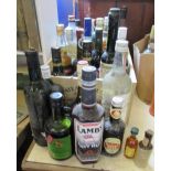 A collection of alcohol, to include a bottle of Drumguish single malt, Lambs Navy rum, Baileys,