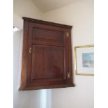 An 18th century oak corner cupboard, width 27ins