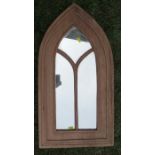 A gothic style wooden framed wall mirror, overall height 28.5ins x 15ins