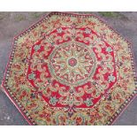 An octagonal rug, diameter 66ins