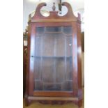 A mahogany corner cupboard, with glazed door, height 38ins