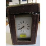 A brass cased carriage clock in travel caseCondition Report: The clock winds but doesn't tick, the