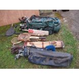 A large collection of golf clubs, cricket bats, etc.