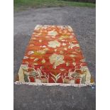 A  modern amber coloured rug, 104ins x 60ins