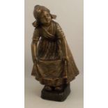 A Goldscheider terracotta figure, of a Dutch girl, with gilt finish, impressed 2995, height 15.