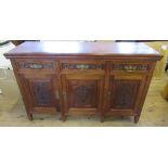 An Edwardian mahogany sideboard, fitted with three frieze drawers over three cupboards, with