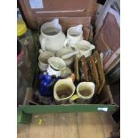 A box of china and sundries, to include Toby jugs, graduated jugs, jelly mould, pestle and mortar,