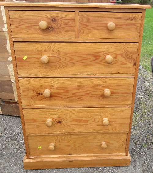 A pine chest, of two short drawers over four long drawers, raised on a plinth base, height 45.5ins x