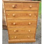 A pine chest, of two short drawers over four long drawers, raised on a plinth base, height 45.5ins x