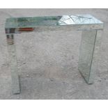 A mirrored dressing table, of rectangular form, 40ins x 15ins x height 31.5ins - cracks to glass