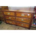 A mahogany chest, of two short over two long drawers with walnut veneered drawer fronts, width