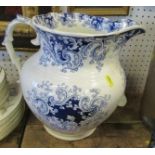 A large 19th century style blue and white jug, height 11ins