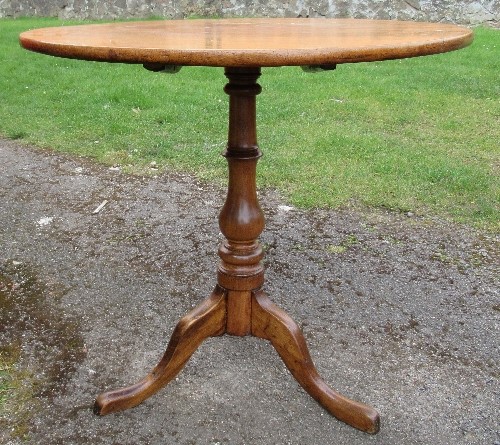 An antique mahogany circular tilt top table, raised on a turned column to a triform base, diameter - Image 3 of 3