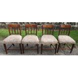 A set of four 19th century mahogany dining chairs, with stuff over seats