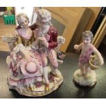 A continental porcelain figure group, and a cherub figureCondition Report: Figure group - Small chip