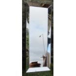 A modern rectangular wall mirror, with mirrored frame, 63ins x 24ins including frame