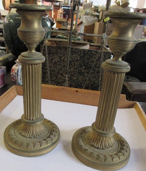 A brass desk tray, fitted with ink wells and pen wells, together with a pair of gilt metal candle - Image 2 of 2