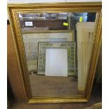 A framed mirror 25.5ins x 16.5ins