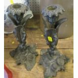 Two metal candle sticks, with ornate leaf decoration, height 10ins