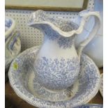 19th century style blue and white wash bowl and jug, decorated with a floral pattern, jug height