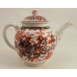 An 18th century English porcelain tea pot, decorated in red and blue with flowers and leaves, af,