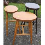 Three oval topped stools, height 21.5ins and 24ins