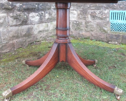 A mahogany tripod dining table, raised on a column with four reeded legs, length closed 54ins, - Image 2 of 2