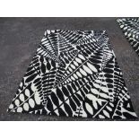 Two modern Harlequin rugs, decorated with foliage, 'Arcadia Black' , 68ins x 94ins