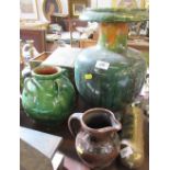 An art pottery vase with green glaze, height 9ins, together with a jug height 7ins, and a large