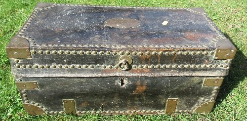 A leather covered trunk having brass corners, studs and handles, the plaque engraved, Lieutenant