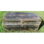 A leather covered trunk having brass corners, studs and handles, the plaque engraved, Lieutenant