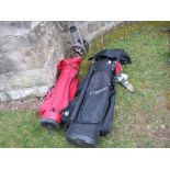 Two bags of golf clubs, together with trolley