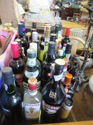 A collection of alcohol, including miniature Eradour whisky