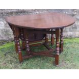 A Georgian style gate leg dining table, 66ins x 42ins