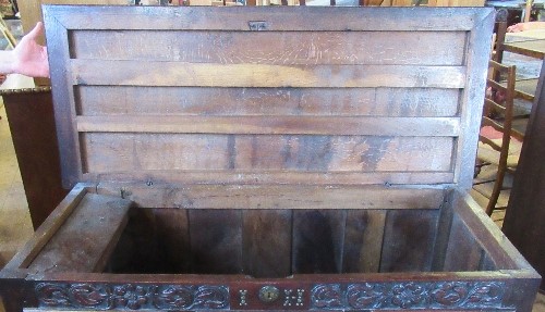 An antique oak mule chest, with rising lid, the front carved with flowers and leaves, fitted with - Image 2 of 4