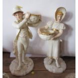 A pair of Royal Worcester Kate Greenaway style figures, of a boy and a girl holding baskets, shape