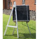 An Archery target boss, height 41ins, width 37.5ins, depth 11ins, together with a wooden stand and