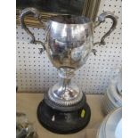 A silver two handled trophy cop, with scroll handles, gadrooned knop and base, with presentation