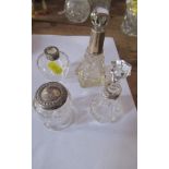Four silver and glass mounted dressing table bottles