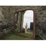 A large hall mirror, with carved oak frame, max width 73ins x height 77ins, plate size 63ins x