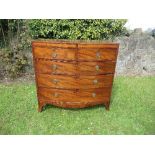 A 19th century mahogany bow fronted chest of drawers, with satinwood cross banding, fitted two short