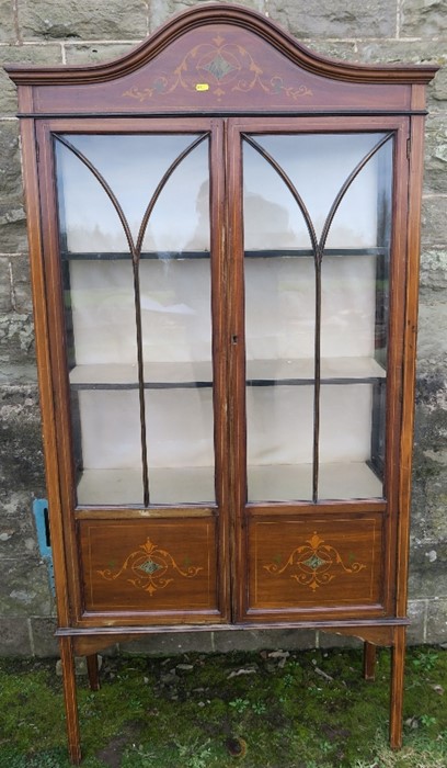 An Edwardian mahogany and inlaid display cabinet, with arched top, width 36ins, height 70ins,