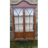 An Edwardian mahogany and inlaid display cabinet, with arched top, width 36ins, height 70ins,