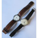 An Omega silver cased wrist watch, with white enamel dial, af, on leather strap, together with an