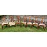 Seven mahogany Queen Anne style dining chairs, with drop in seats