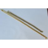 A 9 carat gold chain, 47cm long, 10g gross, together with a costume jewellery chain