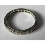 A diamond set full eternity ring, set with twelve single cuts, the engraved white mount stamped '